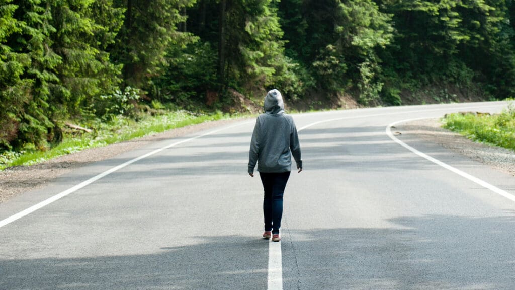 Woman walking on road